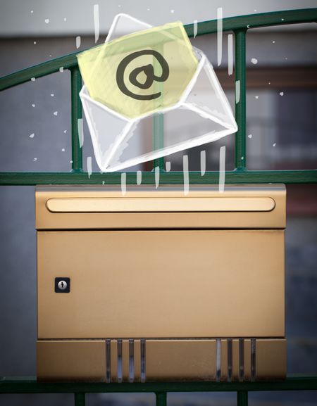 White envelope with email sign dropping into mailbox