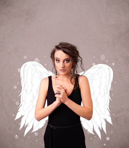 Cute person with angel illustrated wings on grungy background