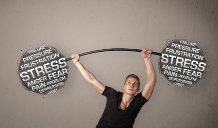 Strong muscular man fighting with stress