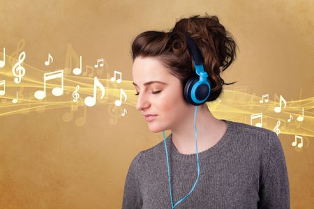 Pretty young woman listening to music, notes concept