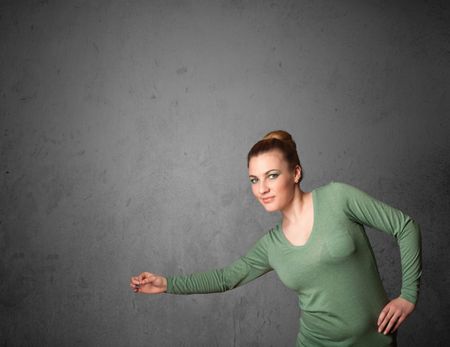 Young woman gesturing with empty space