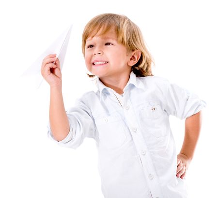 Happy boy playing with a paper plane - isolated over white background 