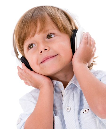 Happy boy wearing big headphones - isolated over white background