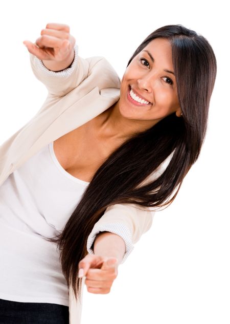 Happy woman pointing to the camera - isolated over a white background 