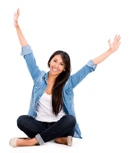 Happy woman with arms up - isolated over a white background
