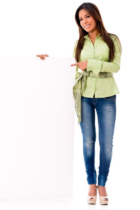 Happy woman pointing at a placard - isolated over a white background 