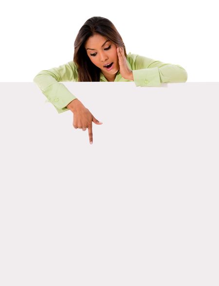 Happy woman pointing at a banner - isolated over a white background 