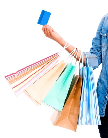 Woman shopping with a credit card - isolated over white background 