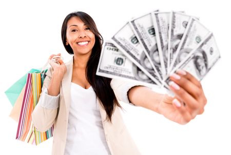 Happy shopping woman with a lot of money - isolated over white