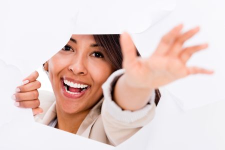 Happy woman urging to come out of a hole and smiling