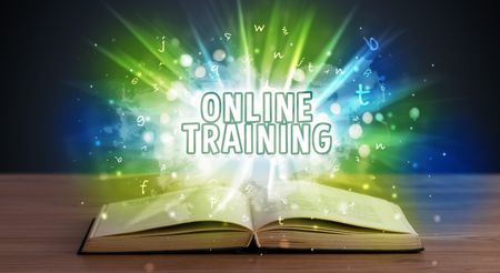 ONLINE TRAINING inscription coming out from an open book, educational concept
