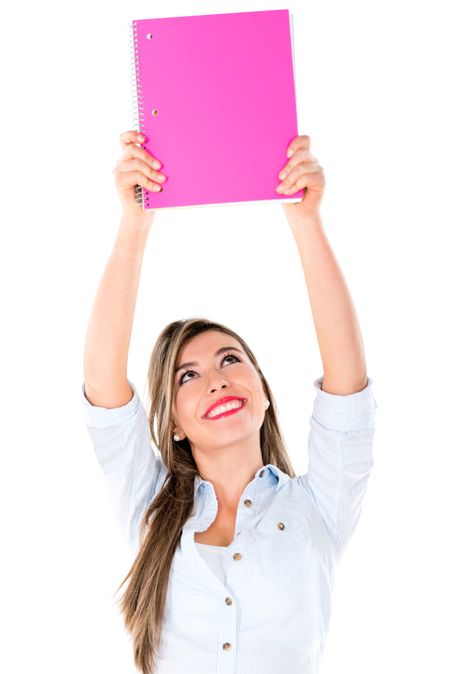 Female student holding notebook with arms up - isolated over white 