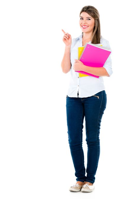 Female student pointing to the side - isolated over white background 