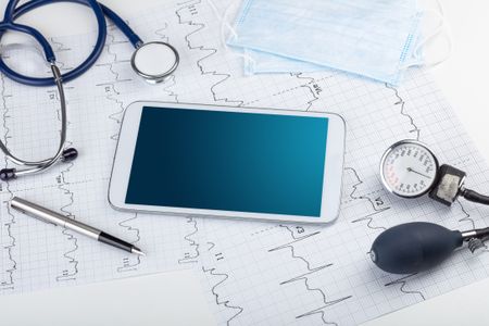 Medicine and modern technology concept with diagnostics concept with free space on tablet screen