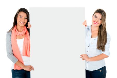 Happy girls holding a banner - isolated over a white background 