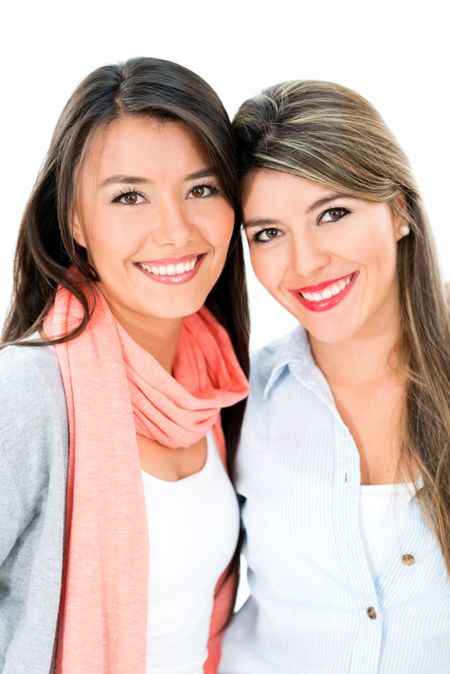 Beautiful girl friends looking happy - isolated over a white background 