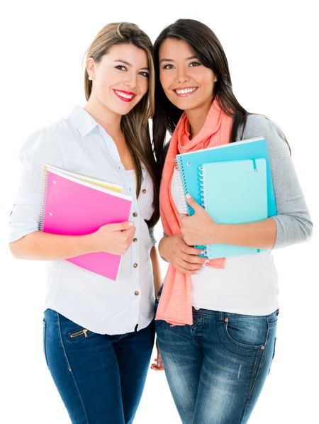 Happy female students wih notebooks - isolated over white background 