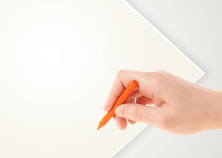 Child drawing with colorful crayon on empty plain blank paper 