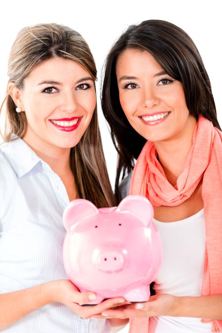 Happy women keeping savings in a piggybank - isolated over a white background 