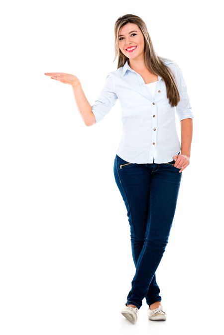 Woman with hand on something displaying imaginary object - isolated over white 