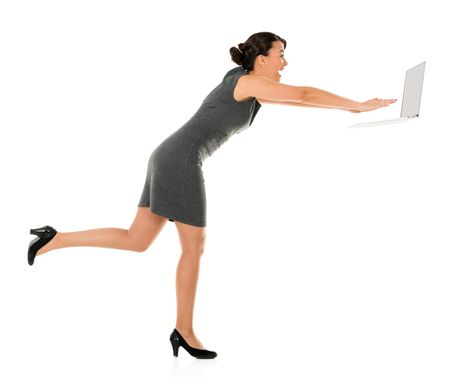 Business woman in a rush working on a laptop - isolated over white background
