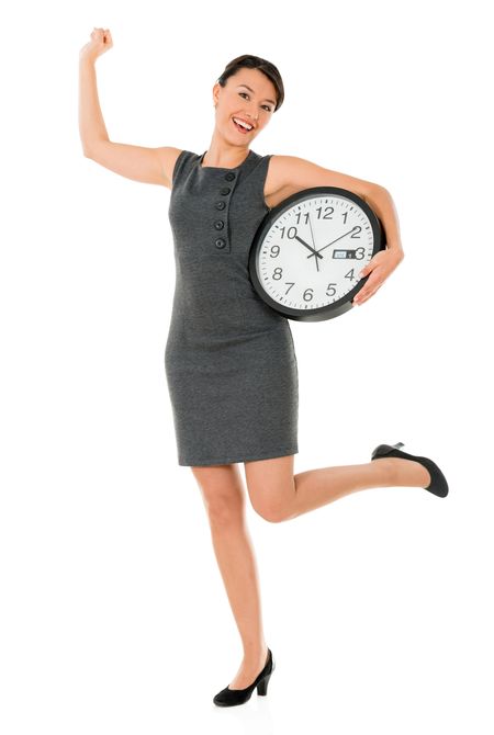 Excited business woman on time with a clock - isolated over white