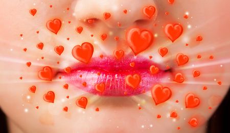 Pretty lady lips with lovely red hearts close up