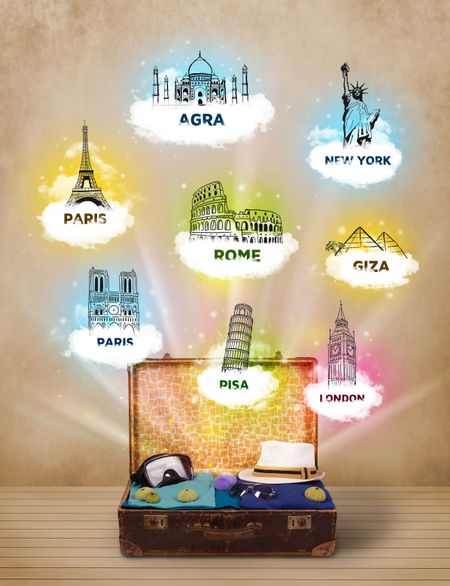 Tourist suitcase with famous landmarks around the world on grungy background