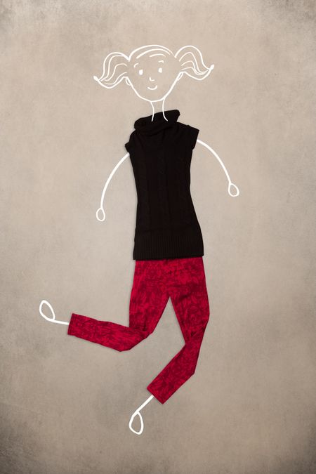 Colorful placed clothes in different actions with woman drawing