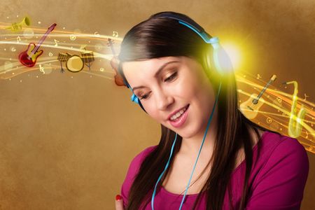 Pretty young woman with headphones listening to music, instruments concept