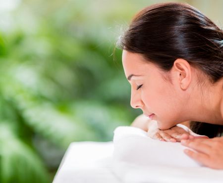 Beautiful young woman relaxing at the spa  