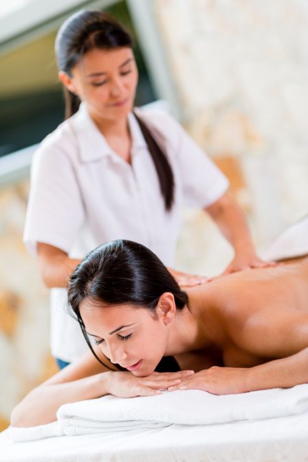 Woman relaxing at the spa getting a massage