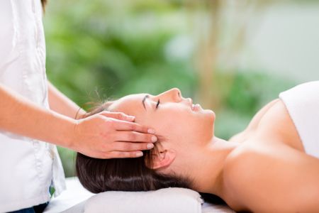Woman in a spa getting a massage and relaxing