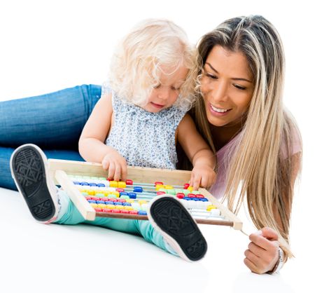 Mother teaching her daughter the abacus - isolated over white background