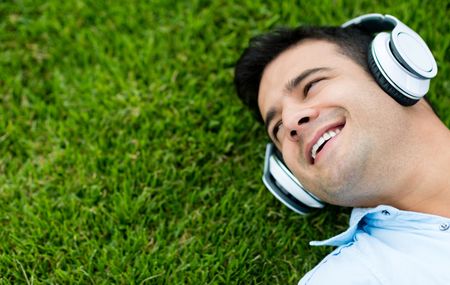 Man listening to music outdoors with headphones