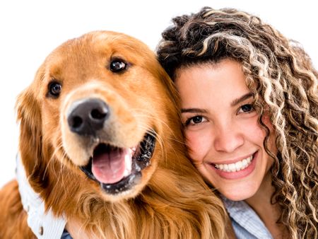 Happy woman with a cute dog - isolated over white background 
