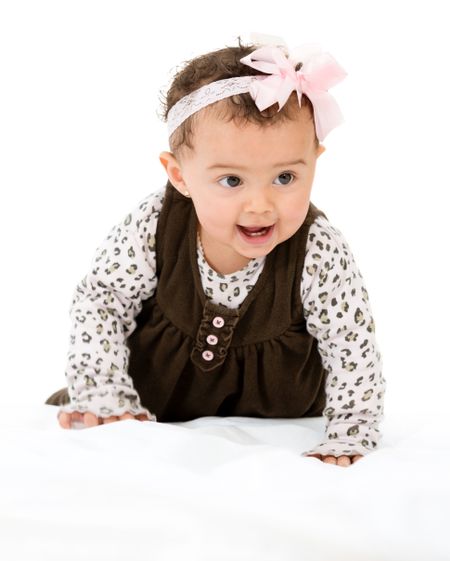 Beautiful baby girl crawling - isolated over a white background 