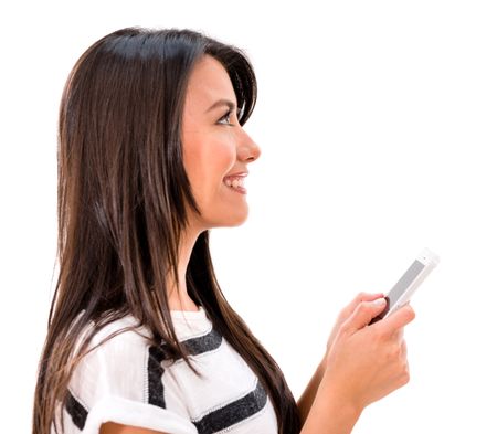 Woman texting on her cell phone - isolated over a white background