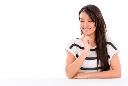 Woman looking at something on the desk - isolated over white background