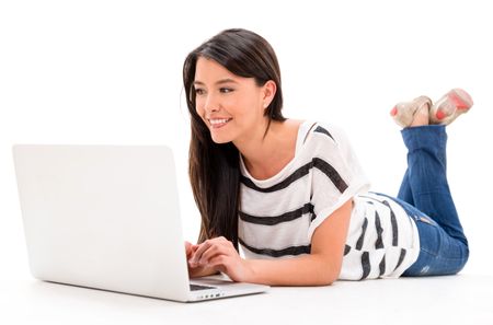 Woman browsing on a laptop computer - isolated over white background 