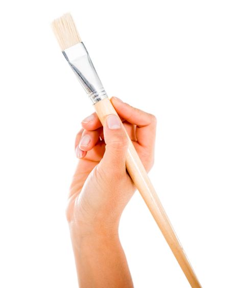 Hand holding a paint brush - isolated over a white background 