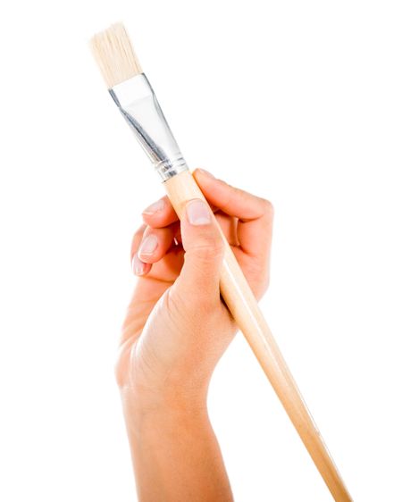 Hand holding a paint brush - isolated over a white background