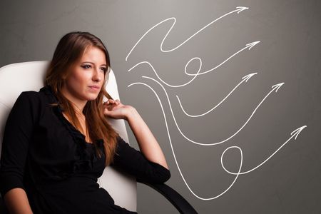 Attractive young teenager looking at multiple curly arrows