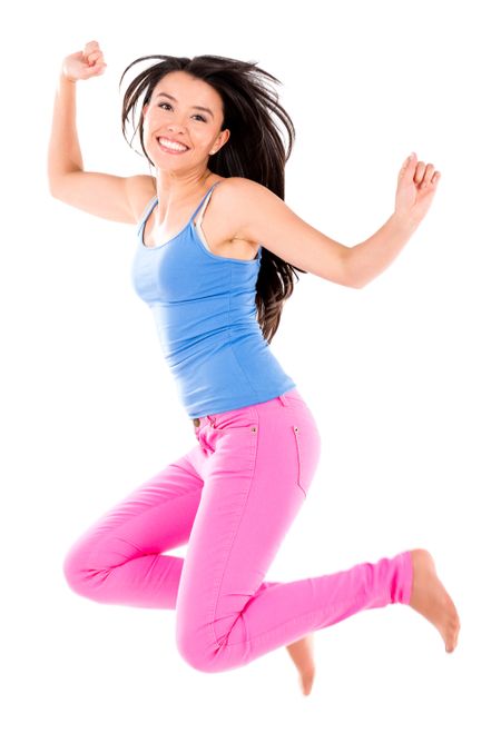 Happy woman jumping and smiling - isolated over white background 