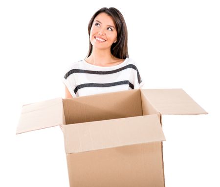 Thoughtful woman moving and holding a box - isolated over white 