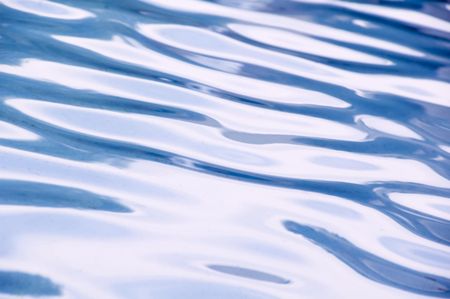 Rippled reflections of sky in an outdoor pool