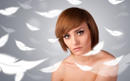 Beautifull young girl with light feather skin concept on gradient background