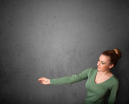 Young woman gesturing with empty space
