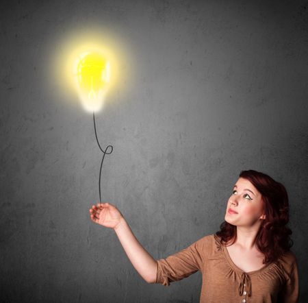 Young woman holding a lightbulb balloon