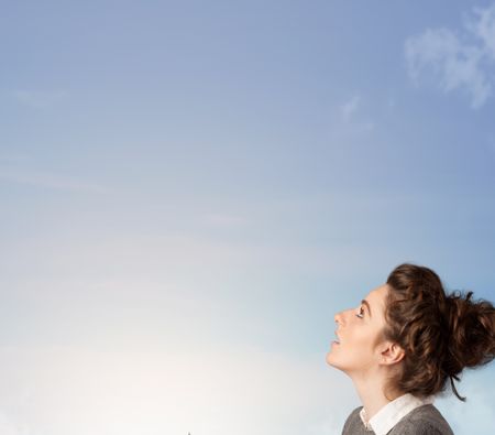 girl-looking-blue-sky-copyspace-concept-159813017 Girl looking at the blue sky copyspace concept